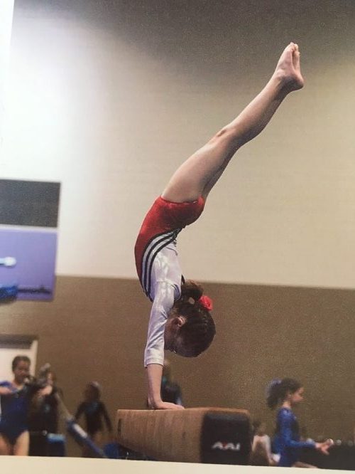 Cori Fischer balancing on her hands