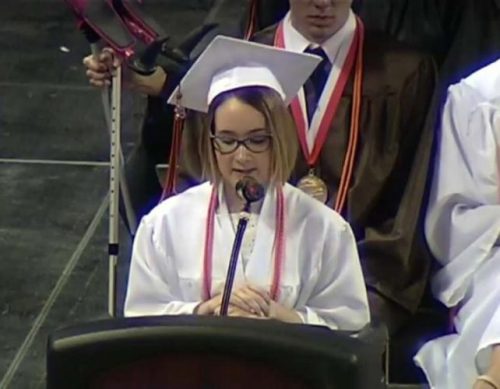 Cori Fischer giving graduation speech about invisible disability