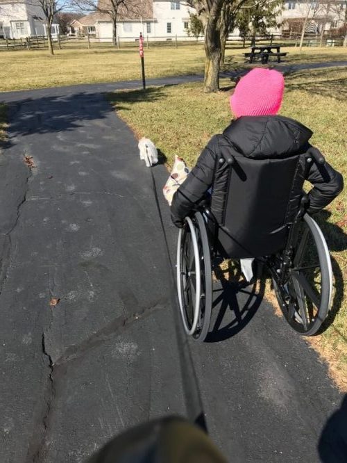 Cori Fischer in wheelchair as she adapts to movement disorder A GUEST POST BY CORI FISCHER