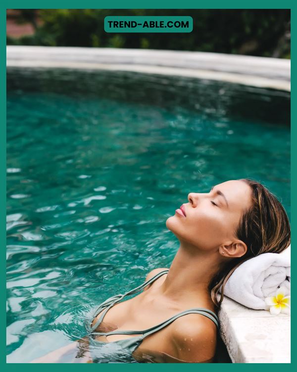 Poolside resort moment with woman enjoying the water.